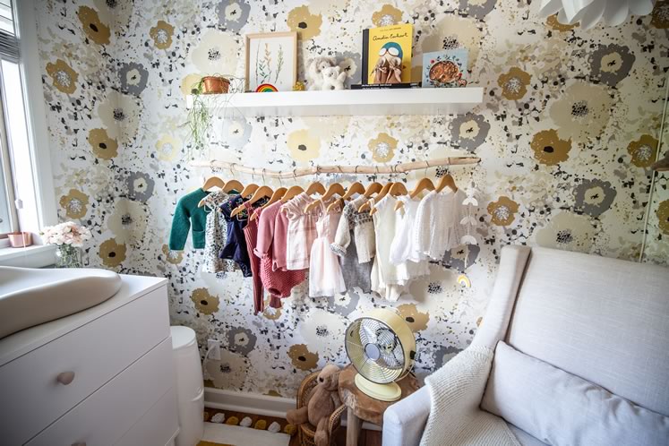 In Willow’s nursery, a hanging branch does the work of a closet. Photo by Erin Fitzgibbon.