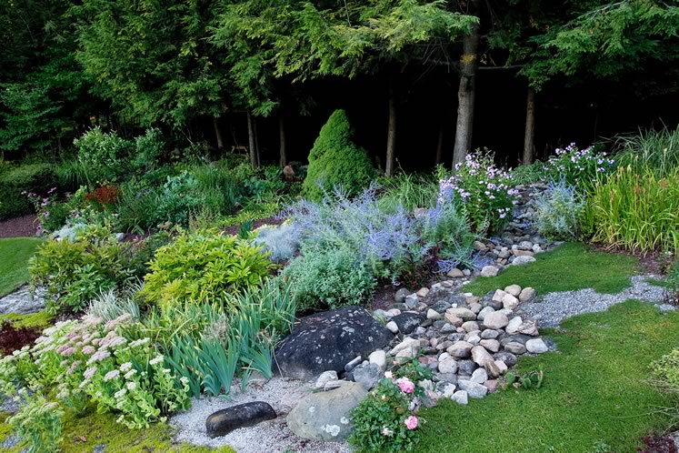 Rocks and gravel run like a natural stream through a section of the garden. Photo by Rosemary Hasner / Black Dog Creative Arts.